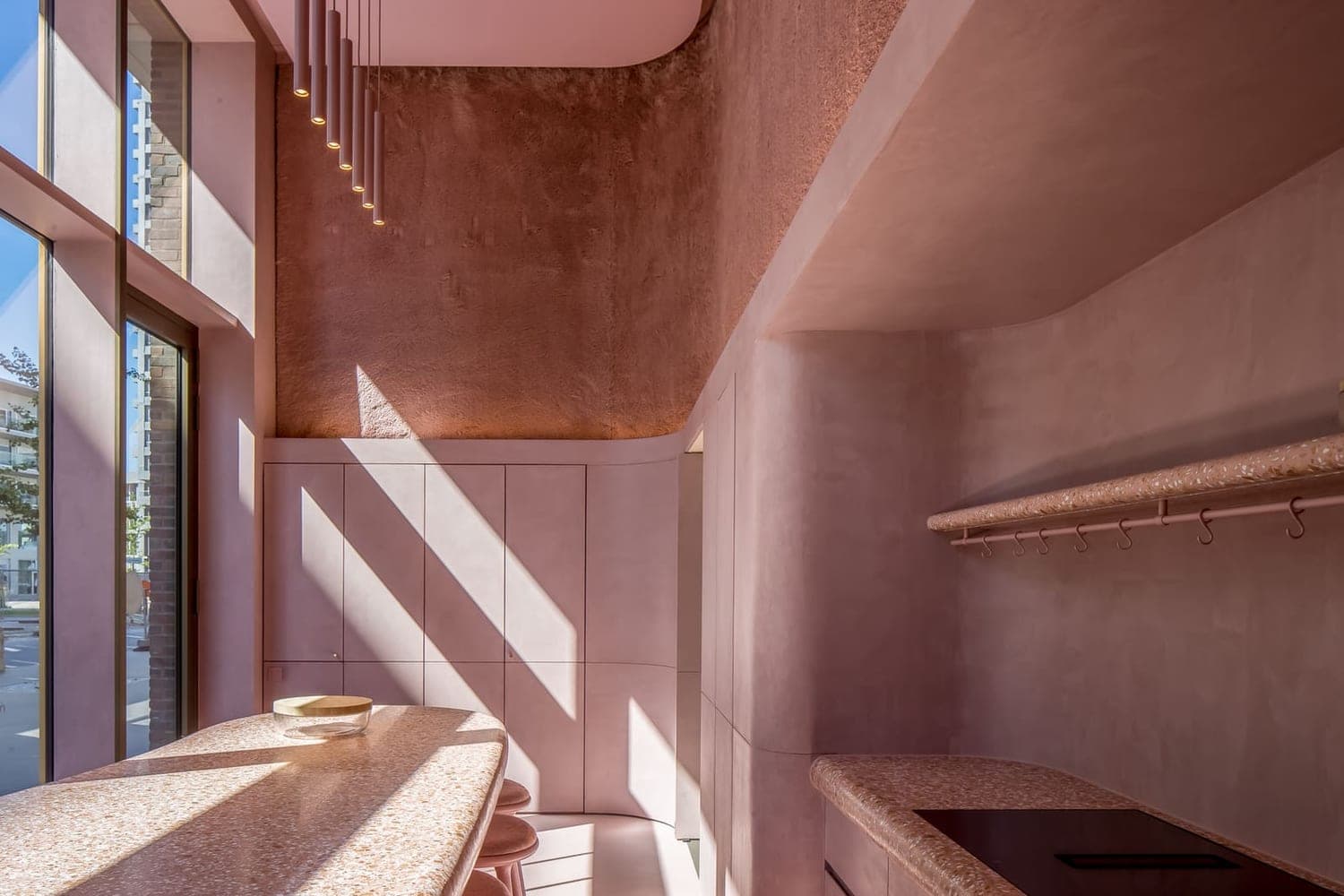 A seamless mineral surface detailed into an architectural interior